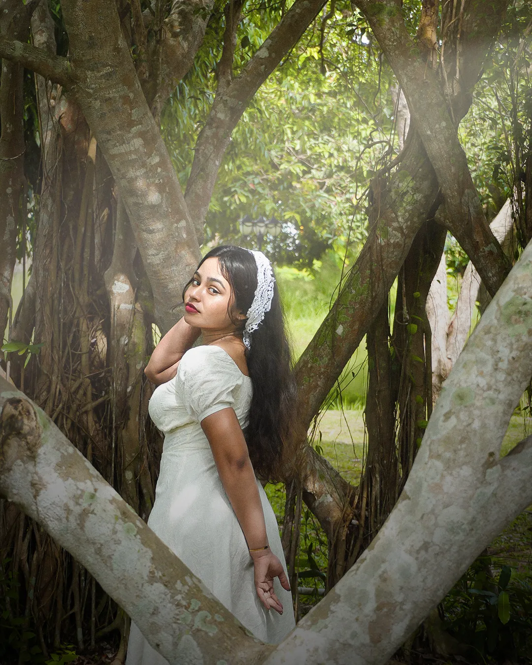 Model beside the banyan tree