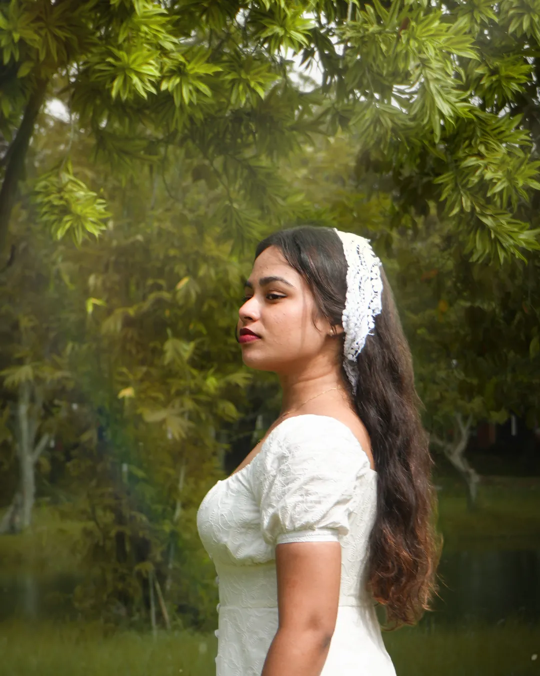 Portrait in dappled light under the trees